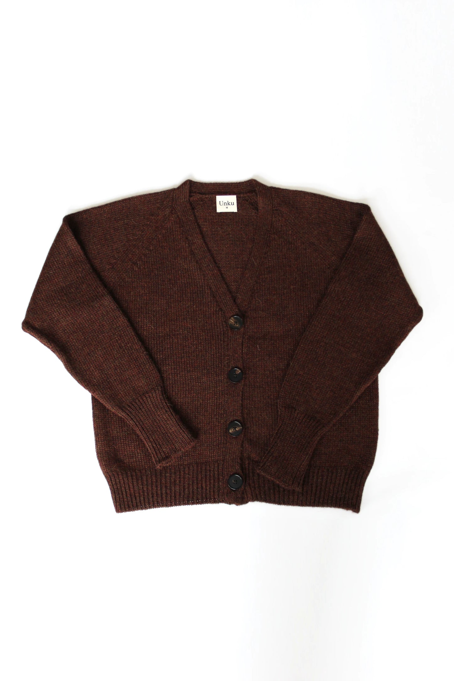 Brown 100% baby alpaca cardigan with black horn buttons on a white background