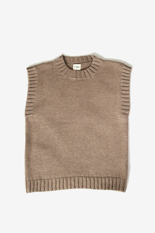 Beige baby alpaca sleeveless vest with ribbed crewneck on white background