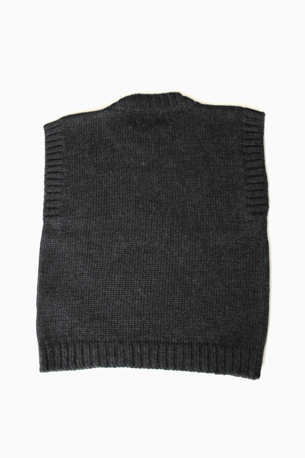 Charcoal baby alpaca sleeveless vest with ribbed crewneck on white background